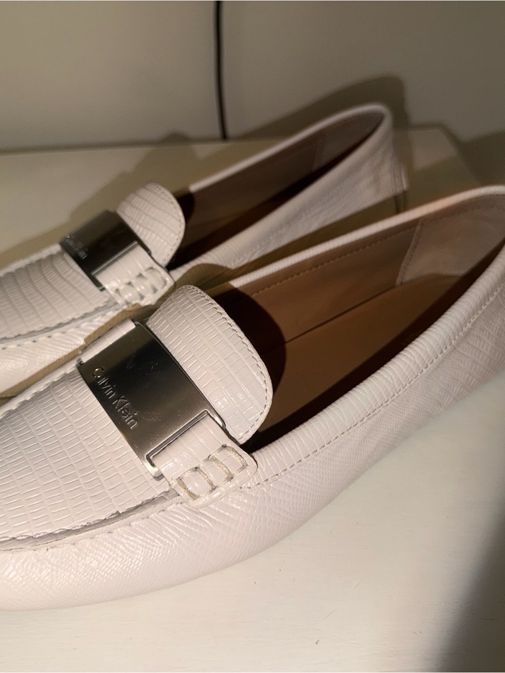 Calvin Klein White Textured Leather Slip-On Loafers with Silver Plaque